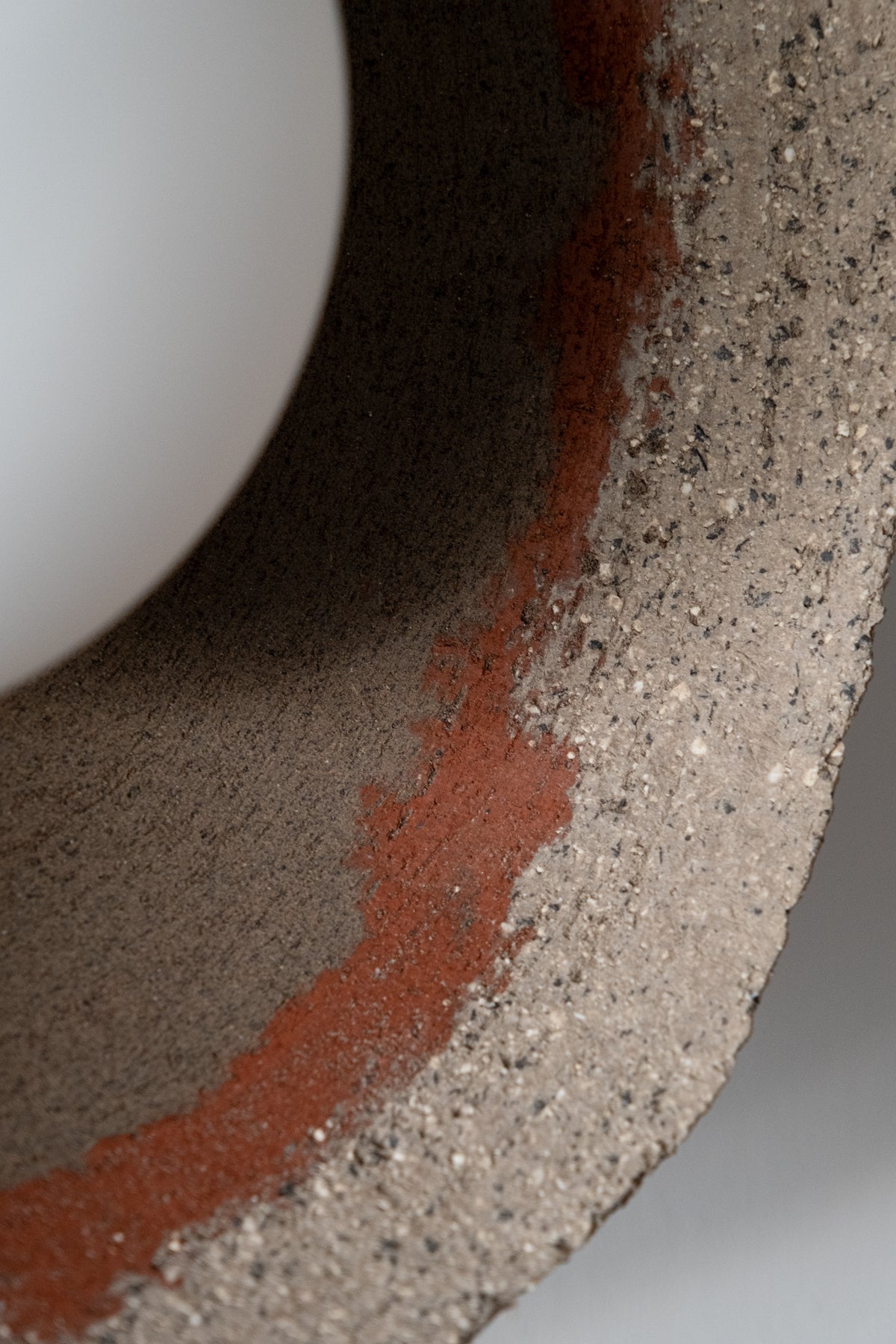 Close-up of the Kaya ceramic shade showing raw unglazed clay texture with terracotta patches