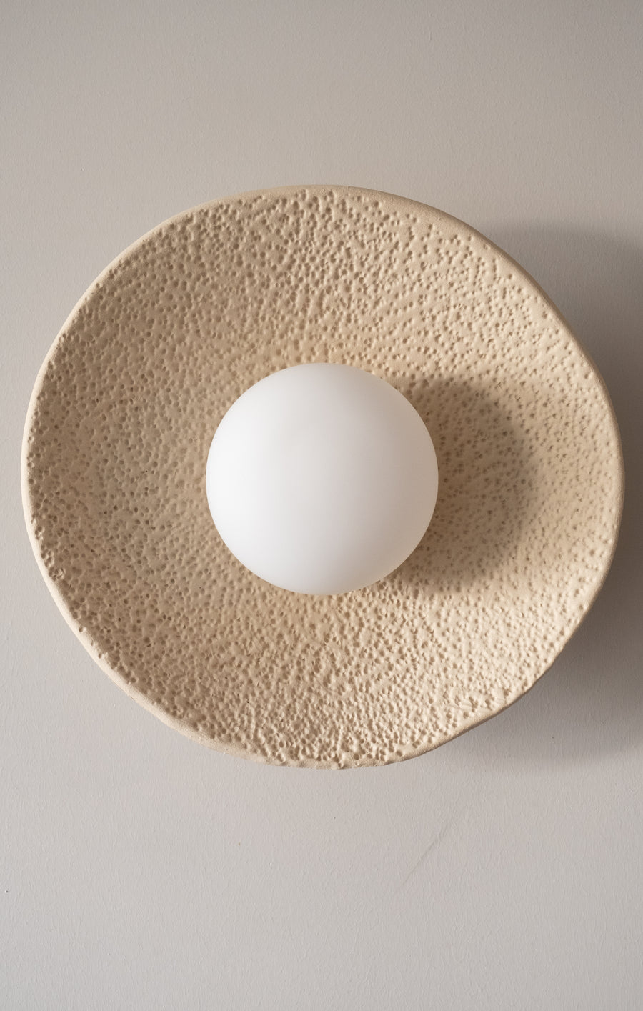 Luma – handmade white ceramic wall sconce in natural stoneware clay by Geza Ceramic Studio
