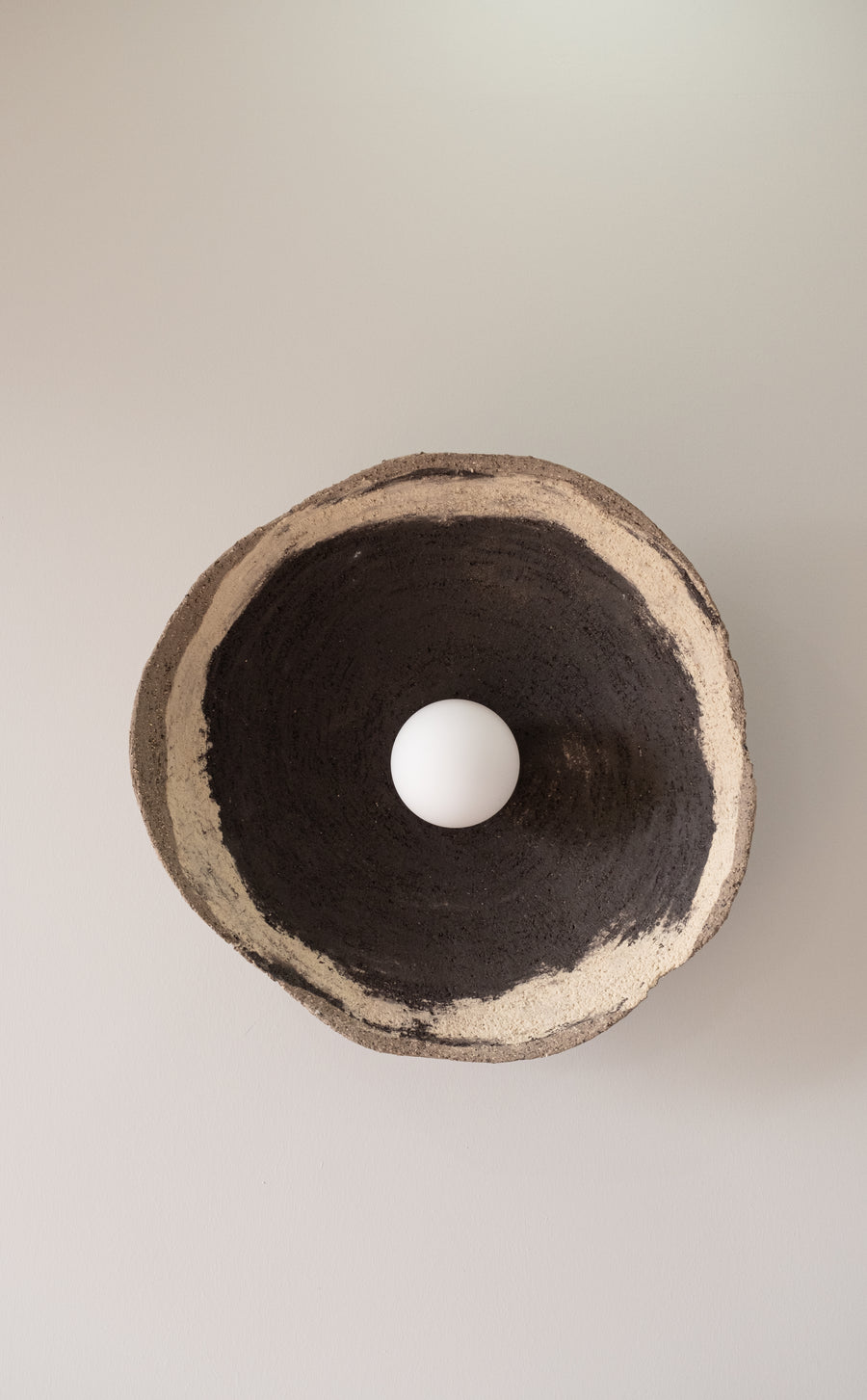 Lyra – handmade black & white ceramic wall sconce in natural stoneware clay by Geza Ceramic Studio