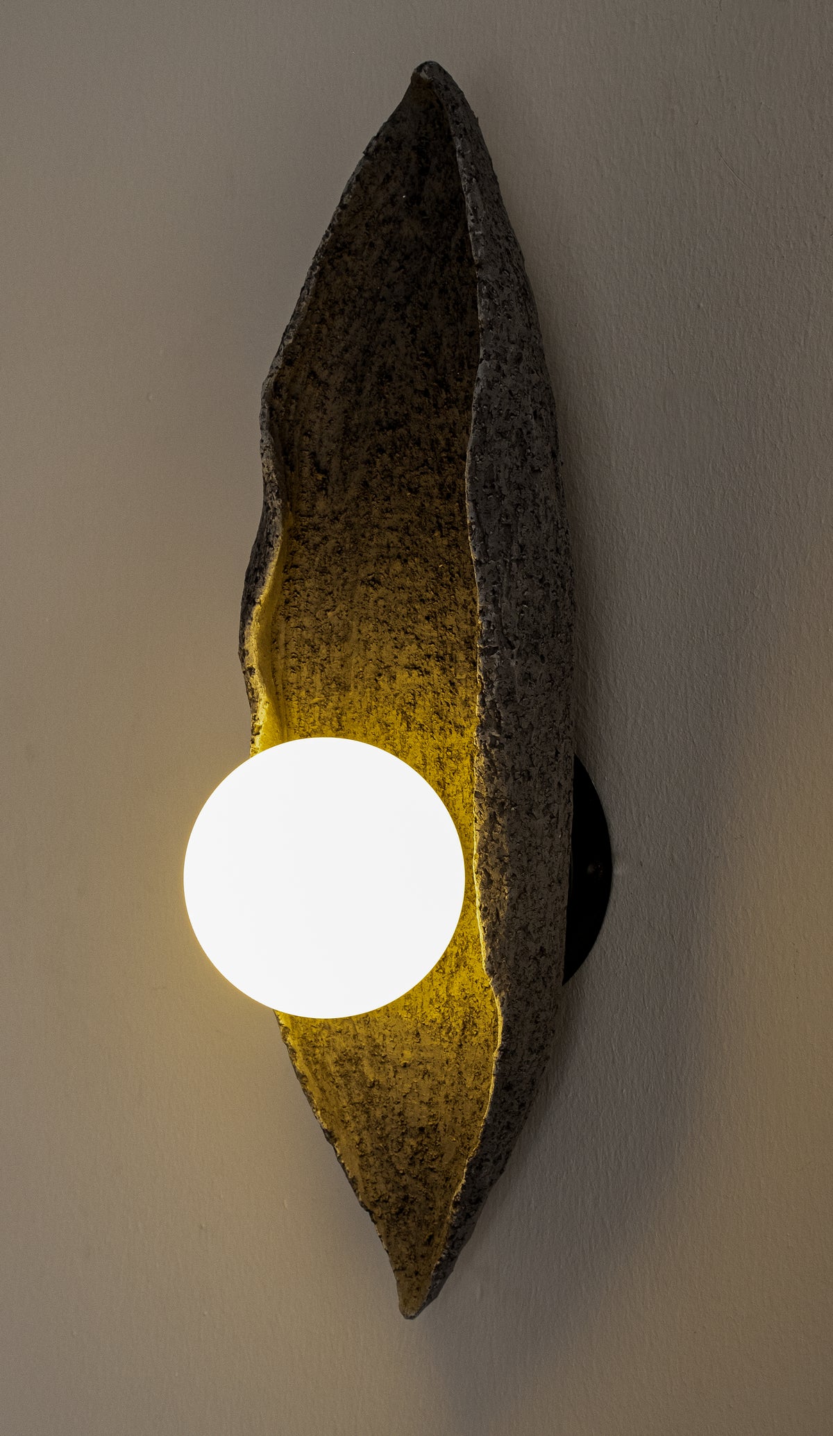 Oryn – handmade black ceramic wall sconce in natural stoneware clay by Geza Ceramic Studio