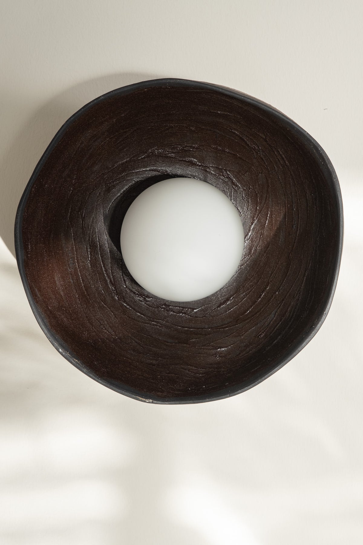 Cyris – handmade black ceramic wall sconce in natural clay, Geza Ceramic – image 3