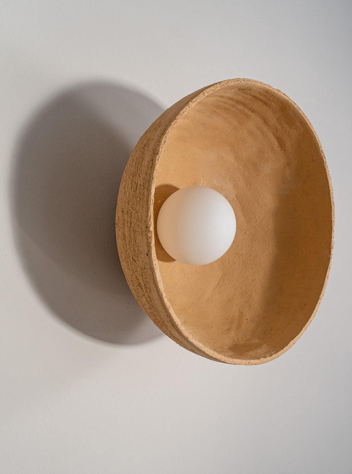 Orin – handmade yellow ceramic wall sconce in natural stoneware clay by Geza Ceramic Studio