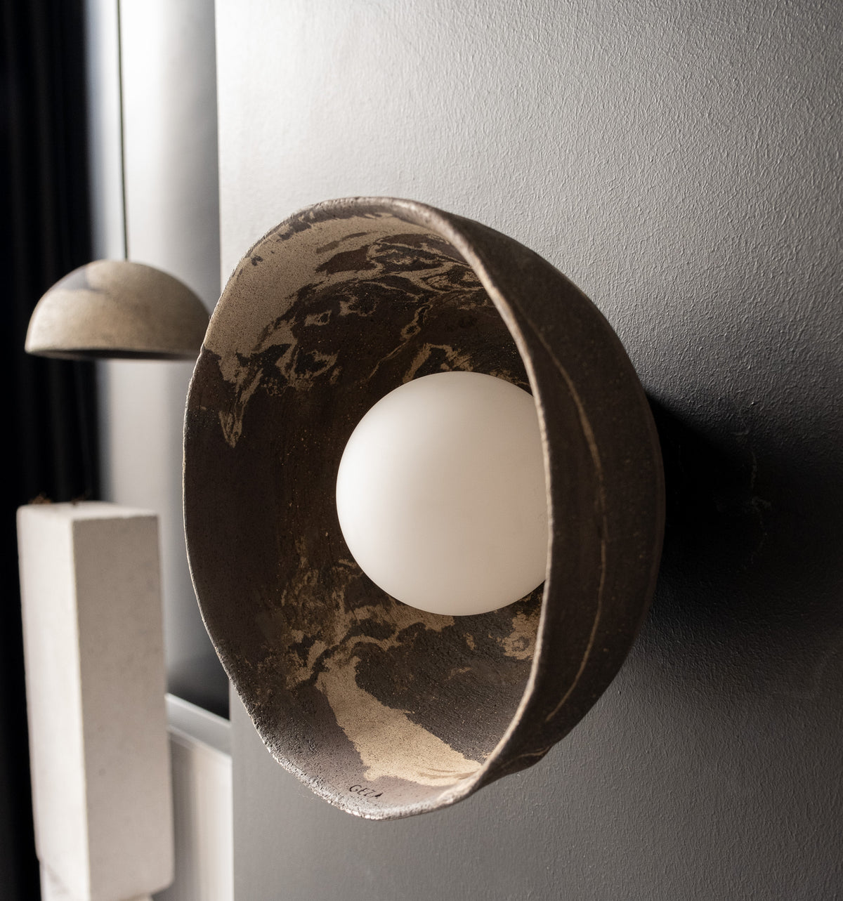 Elyra – handmade dark brown ceramic wall sconce in natural stoneware clay by Geza Ceramic Studio