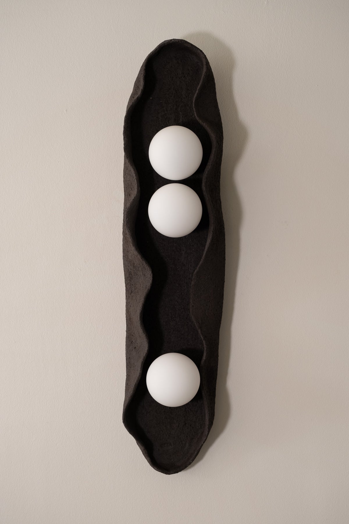 Noa – handmade black ceramic wall sconce in natural stoneware clay by Geza Ceramic Studio