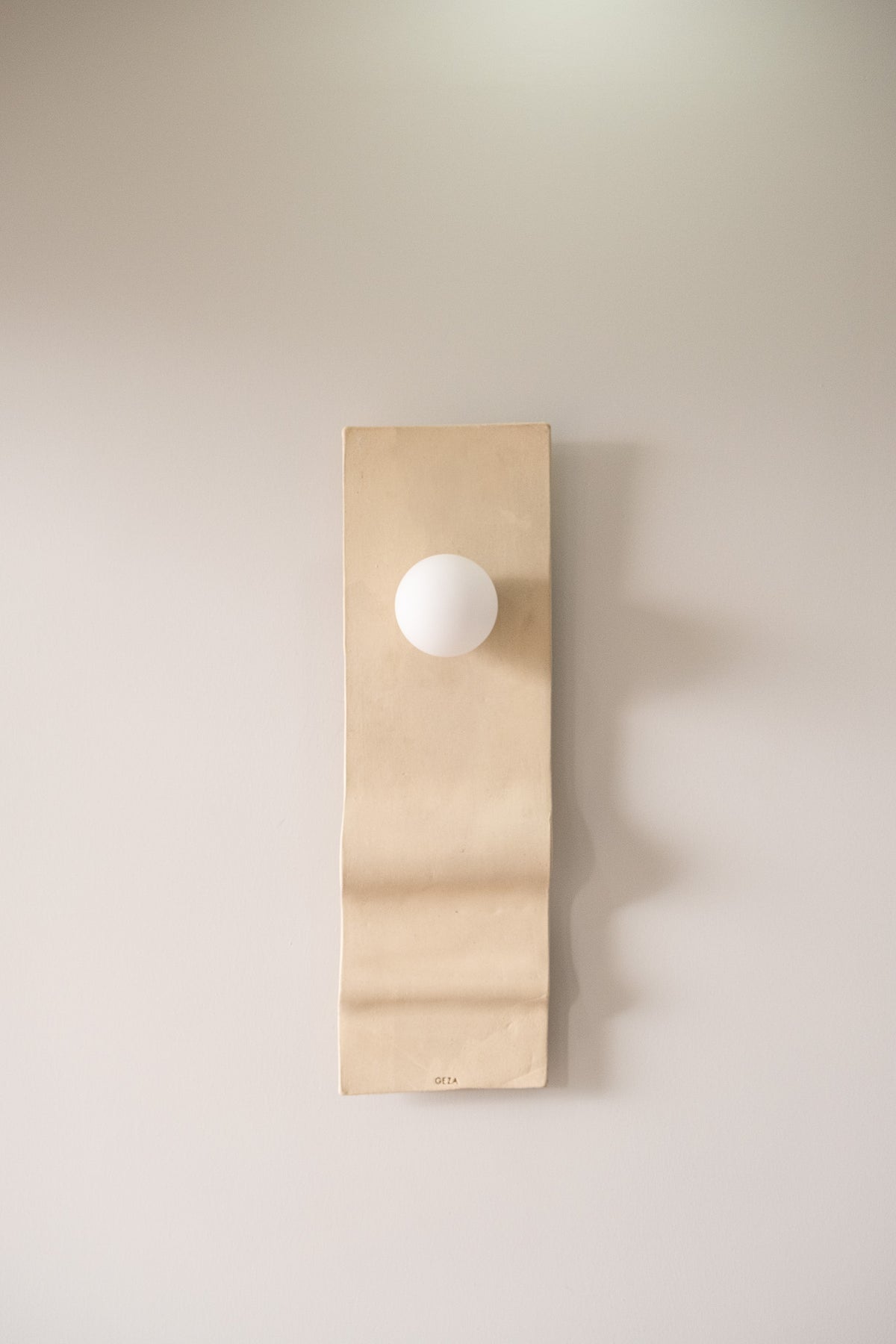 Calypso – handmade beige ceramic wall sconce in natural stoneware clay by Geza Ceramic Studio