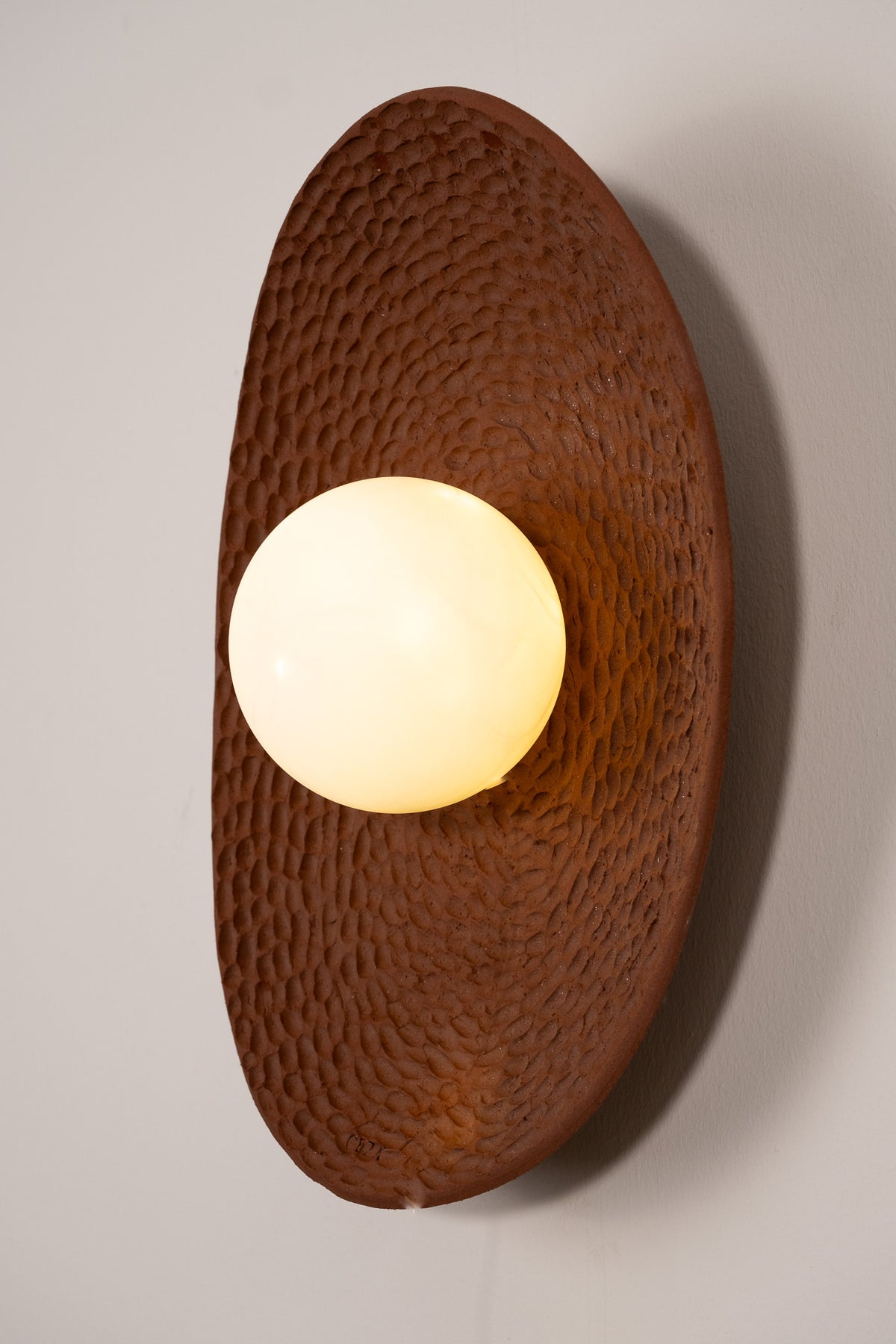 Aerin – handmade terracotta ceramic wall sconce in natural stoneware clay by Geza Ceramic Studio